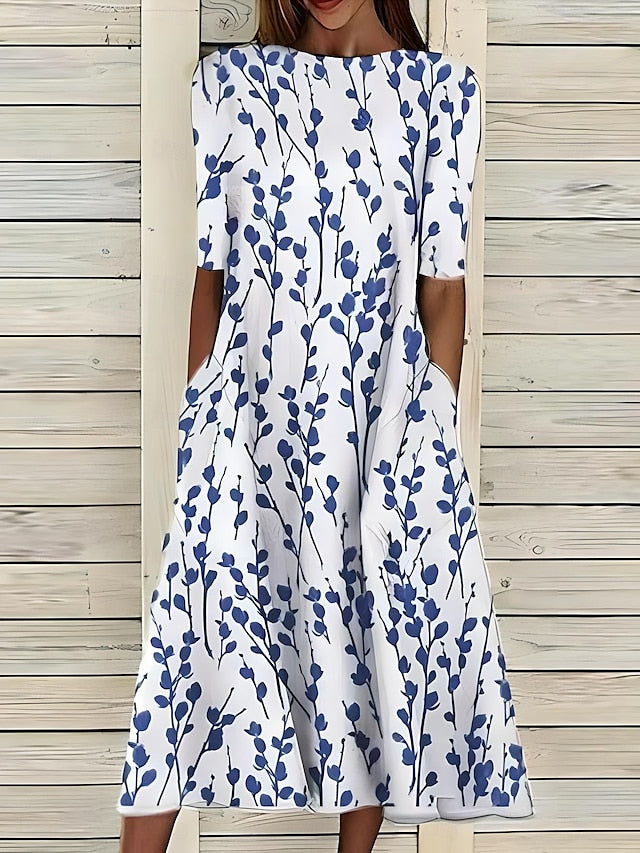 Selma – Vestido midi estampado con bajo de volante